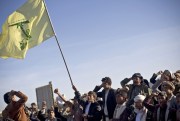 A Houthi Yemeni holding a flag of Hezbollah chants slogans during a rally to show support for their comrades in Sanaa, Yemen, Jan. 28, 2015 (AP photo by Hani Mohammed).