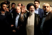 Iranian cleric Ebrahim Raisi waves to the media as he registers for the May 19 presidential vote, Tehran, Iran, April 14, 2017 (AP photo by Ebrahim Noroozi).