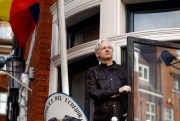 Julian Assange greets supporters outside the Ecuadorian Embassy in London, May 19, 2017 (AP photo by Frank Augstein).