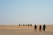 Three men head north toward Algeria after crossing the Assamaka border post in northern Niger, June 3, 2018 (AP photo by Jerome Delay).