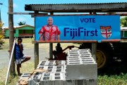 A FijiFirst poster with the image of Fijian Prime Minister Frank Bainimarama is displayed at the entrance to a village in Nausori, Fiji, Nov. 7, 2018 (AP photo).