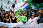 People march to protest against the deforestation of the Chaco region, in Asuncion, Paraguay, Jan. 11, 2019 (AP photo by Jorge Saenz).