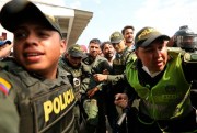 Colombian police escort a Venezuelan soldier who defected at the Simon Bolivar international bridge, Cucuta, Colombia, Feb. 23, 2019 (AP photo by Fernando Vergara).