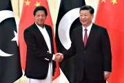 Chinese President Xi Jinping, right, shakes hands with Pakistani Prime Minister Imran Khan.