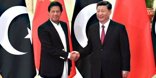 Chinese President Xi Jinping, right, shakes hands with Pakistani Prime Minister Imran Khan.