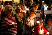 Hundreds of demonstrators hold candles to protest against proposed changes to Poland’s justice system, in Warsaw, Poland, Aug. 3, 2018 (AP photo by Czarek Sokolowski).