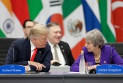 British Prime Minister Theresa May listens to U.S. President Donald Trump during the G-20 summit in Buenos Aires, Argentina, Nov. 30, 2018 (AP photo by Natacha Pisarenko).