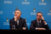 Argentine President Mauricio Macri gives a press conference alongside his running mate, Miguel Angel Pichetto, the day after primary elections in Buenos Aires, Argentina, Aug. 12, 2019 (AP photo by Natacha Pisarenko).