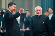 Chinese President Xi Jinping welcomes Indian Prime Minister Narendra Modi for a meeting at the Shanghai Cooperation Organization Summit in Qingdao, June 10, 2018 (AP photo by Alexander Zemlianichenko).