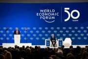 World Economic Forum founder and Executive Chairman Klaus Schwab listens as President Donald Trump delivers opening remarks at the World Economic Forum, in Davos, Switzerland, Jan. 21, 2020 (AP photo by Evan Vucci).