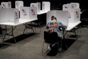 A voter fills out a ballot at the National World War I Museum in Kansas City, Mo., Nov. 3, 2020 (AP photo by Charlie Riedel).