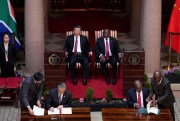 Chinese President Xi Jinping sits beside South African President Cyril Ramaphosa.