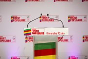 A lectern with signs for the New Popular Front in France.