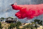 An air tanker drops retardant while battling the fire in California.