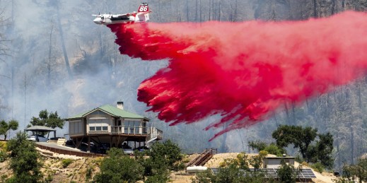 An air tanker drops retardant while battling the fire in California.