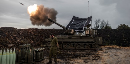 Israeli soldiers fire artillery near the border with Lebanon.