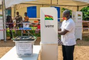 A voter casts his ballot at a polling station in Accra, Ghana.