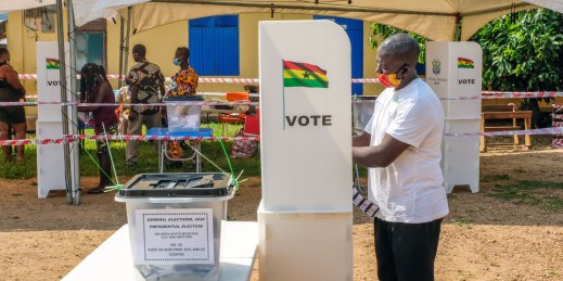 A voter casts his ballot at a polling station in Accra, Ghana.