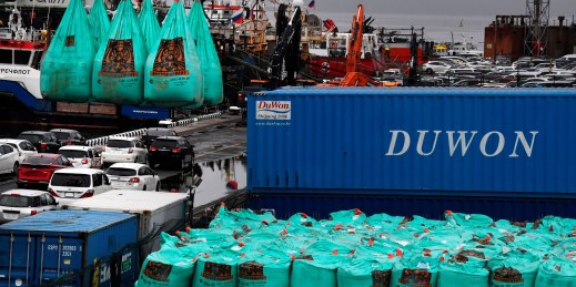 Bags of cement are loaded for transport.