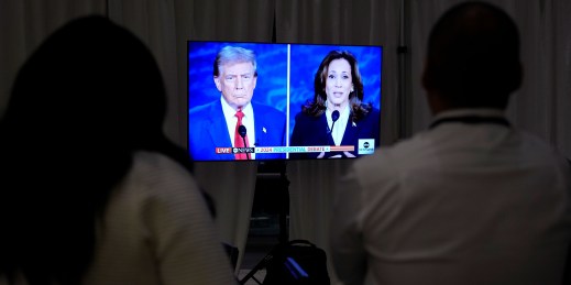 Staff watch a presidential debate between Democratic presidential nominee Vice President Kamala Harris and Republican presidential nominee former President Donald Trump.