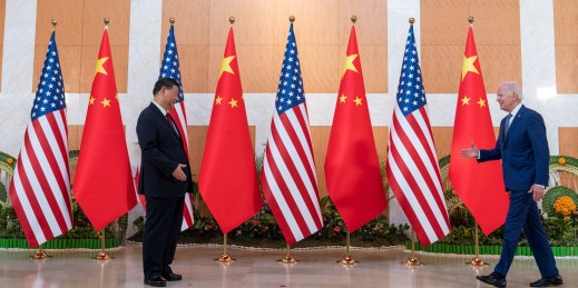 U.S. President Joe Biden walks to greet Chinese President Xi Jinping.