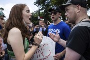 An abortion rights advocate argues with an anti-abortion demonstrator.