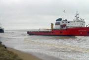 Two ships ship lie grounded ashore in the Caspian Sea.