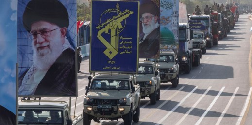 Military trucks carry portraits of Supreme Leader Ayatollah Ali Khamenei in Iran.