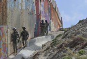 Mexican immigration officers along with military units from the national guard and marines patrol the U.S.-Mexico border.